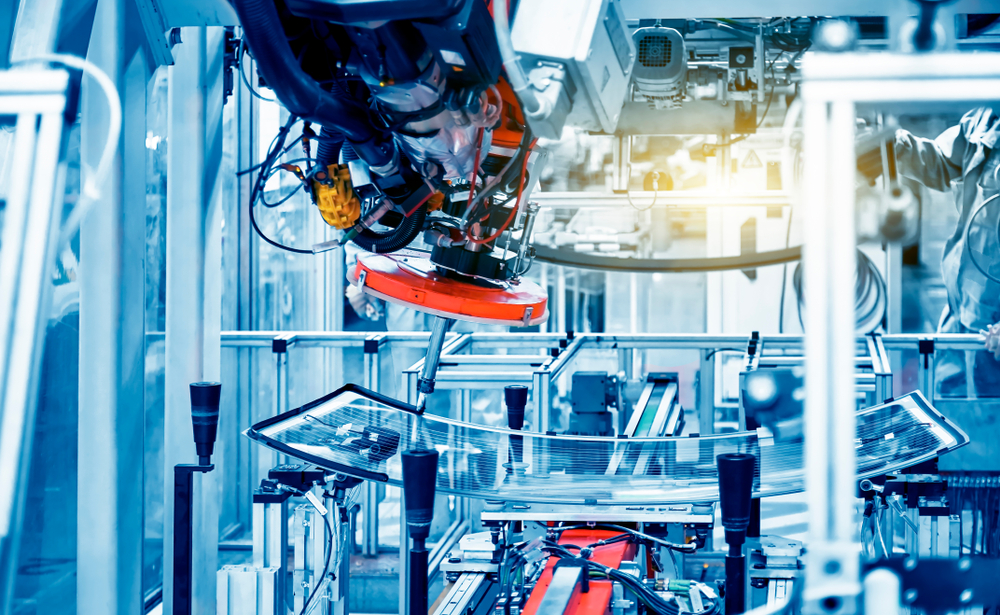 the,arm,of,the,automobile,manufacturing,plant,is,being,glued